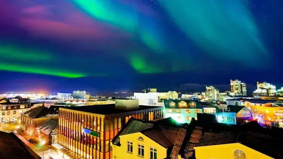 Northern Lights seen over Reykjavík city centre in Iceland.