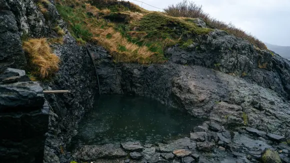 Hellulaug Hot Spring in Westfjords, Iceland.