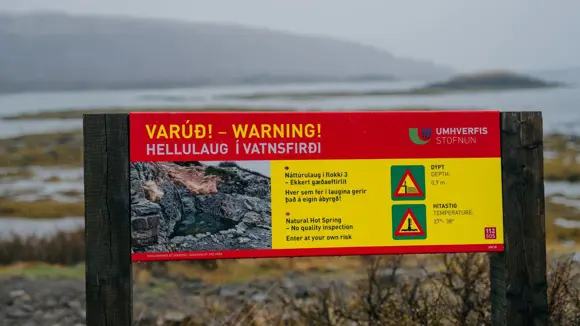 Sign at Hellulaug Hot Spring in Iceland.